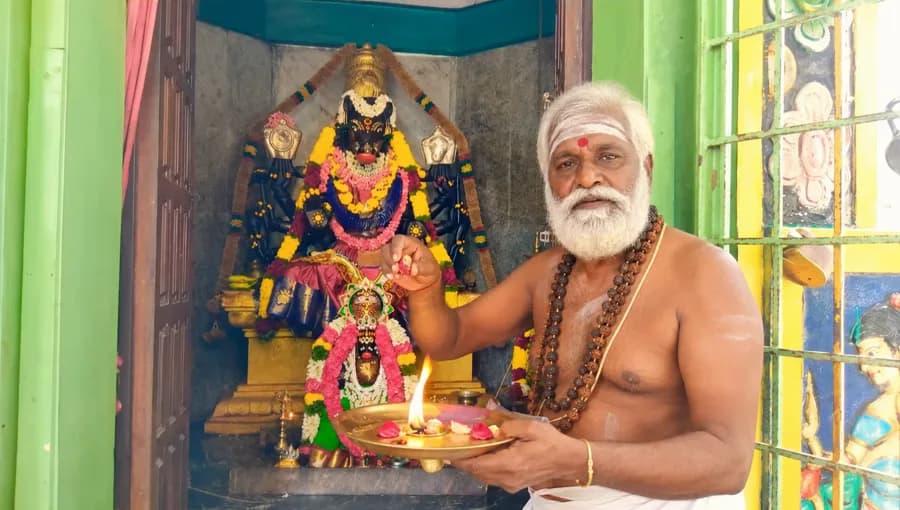 Archaka performing puja